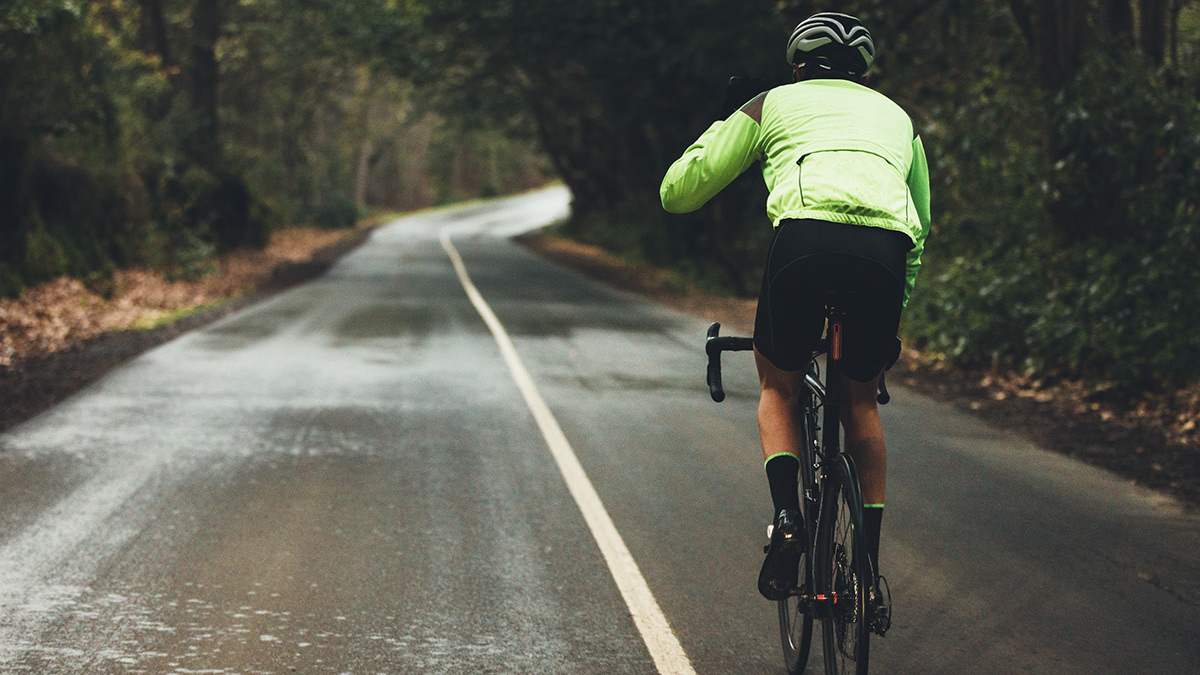 Cyclist On Paved Road