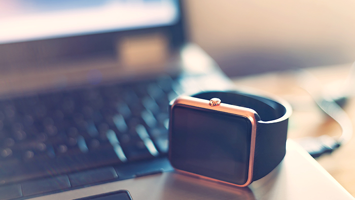 Apple Watch In Front Of Laptop With Trainingpeaks Software