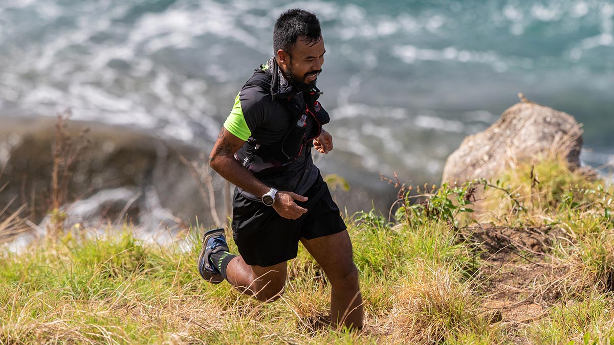 Trail Runner Male Athlete Running In The Mountains To Maintain Consistent Training