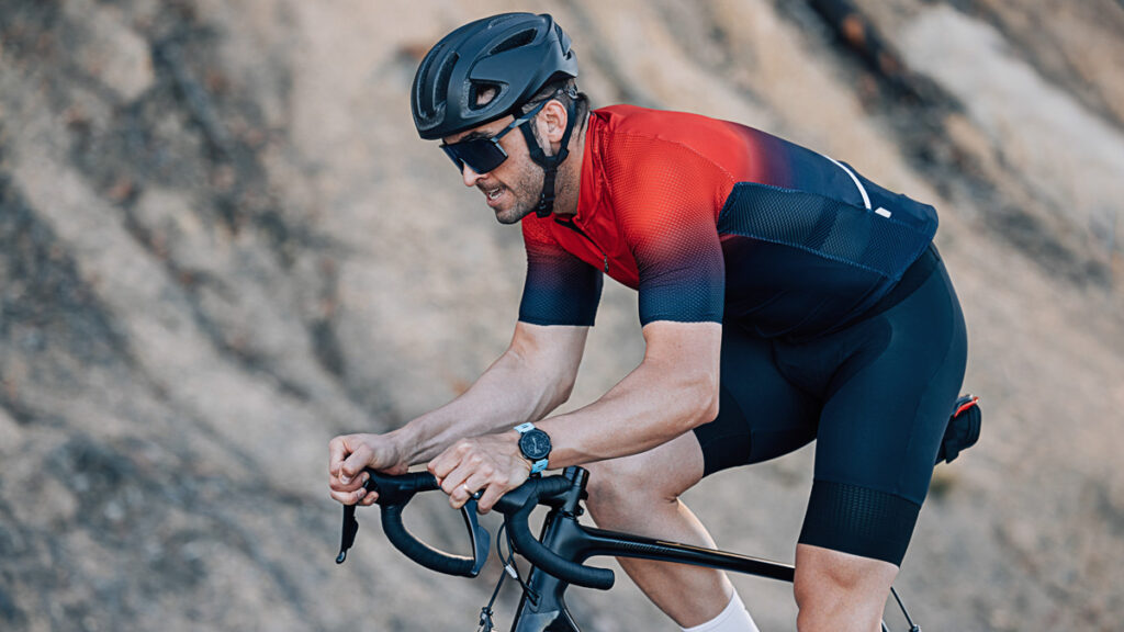 image of a male cyclist on mountainous road completing ftp training intervals in order to increase ftp