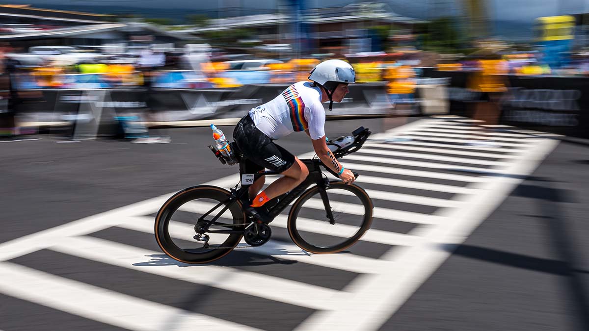 An Athlete Riding Her Bike On The Course Of A Full Distance Triathlon Race