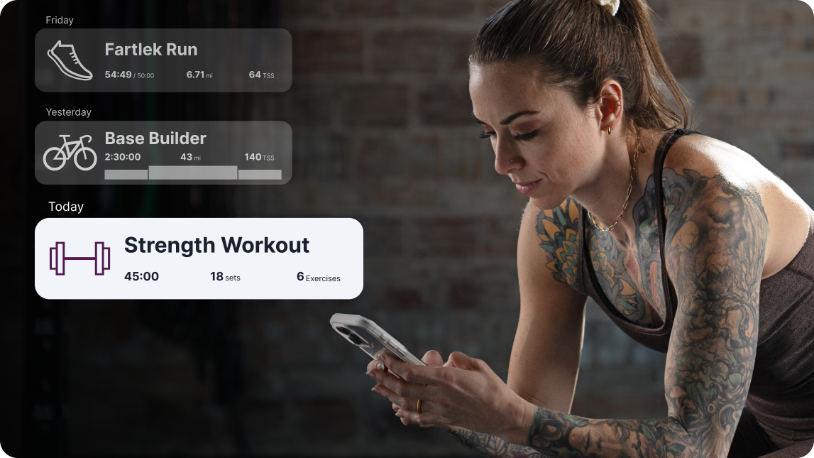 A Female Athlete Looks At Her Phone In A Gym. Overlaid On The Graphic Are A Run, Bike And Strength Workout Elements From The Trainingpeaks Application