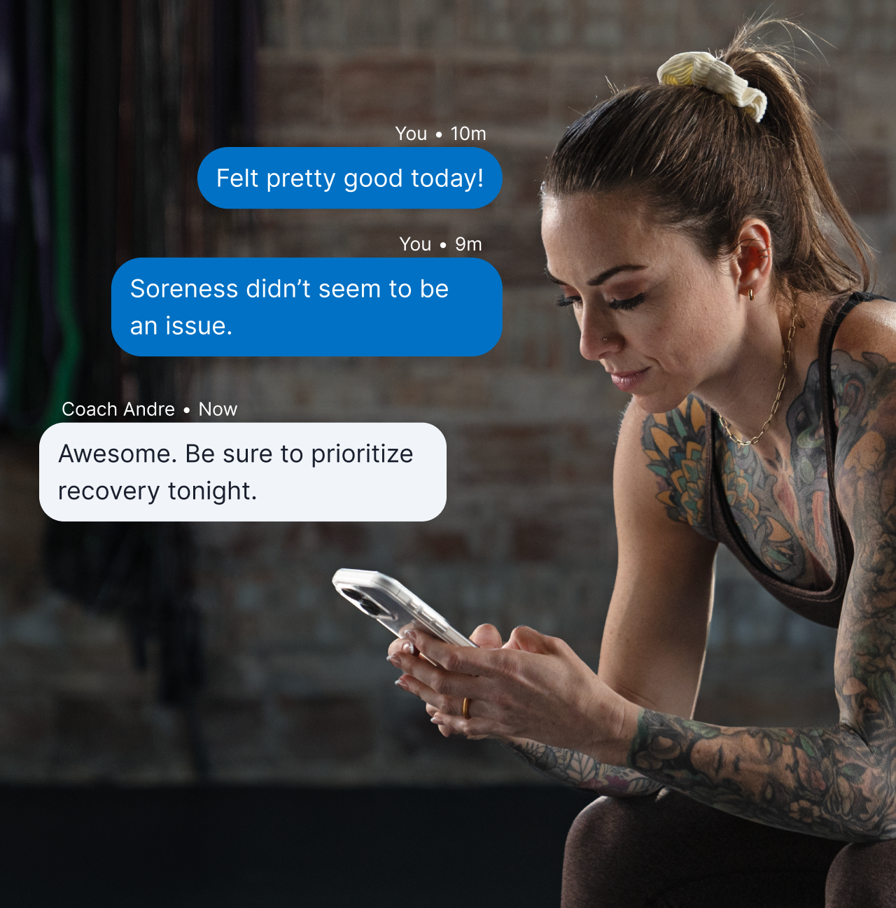 A Woman Athlete Looks At Her Phone In The Gym. On The Image Is A Graphic Overlay Of A Chat Message With The Athlete And Her Coach.