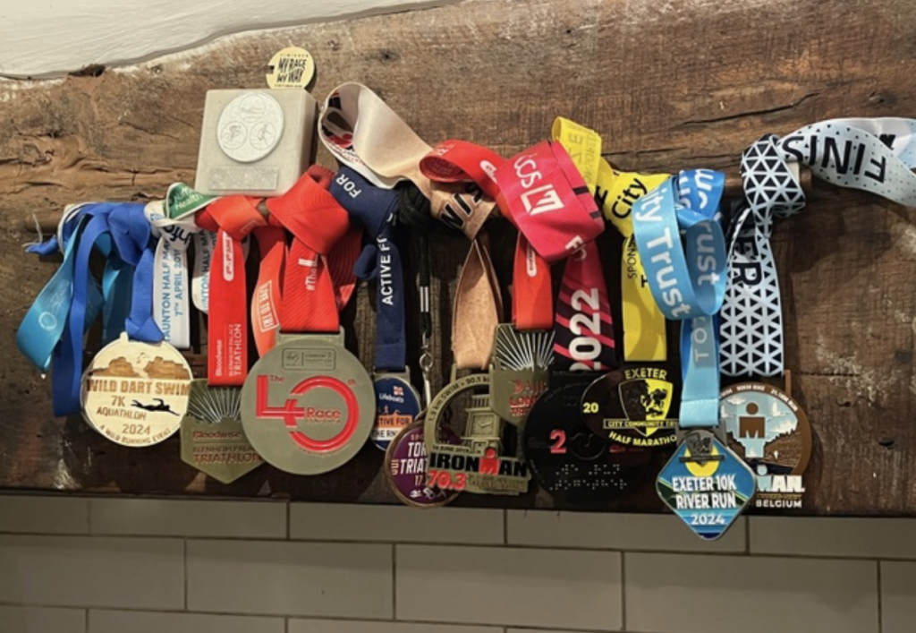 Triathlon medals in on wall